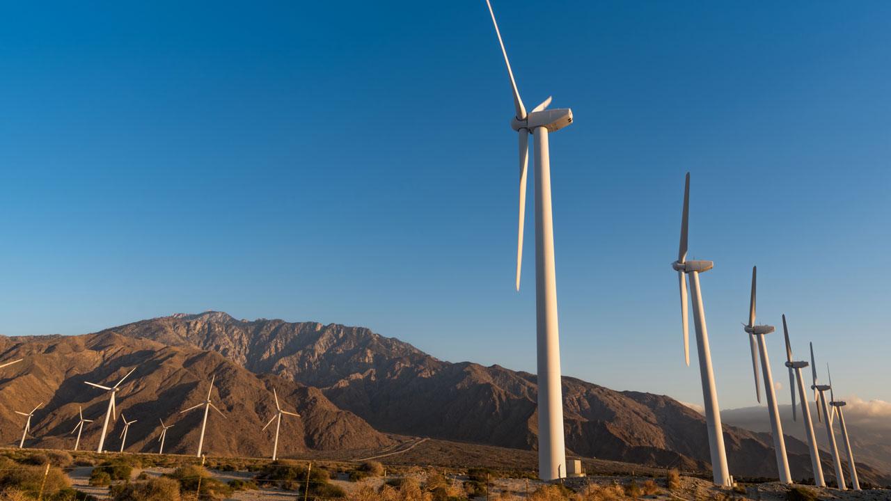 Wind farm in a mountainous area, an example of Tetra Tech's clean energy consulting and electric utility advisory services